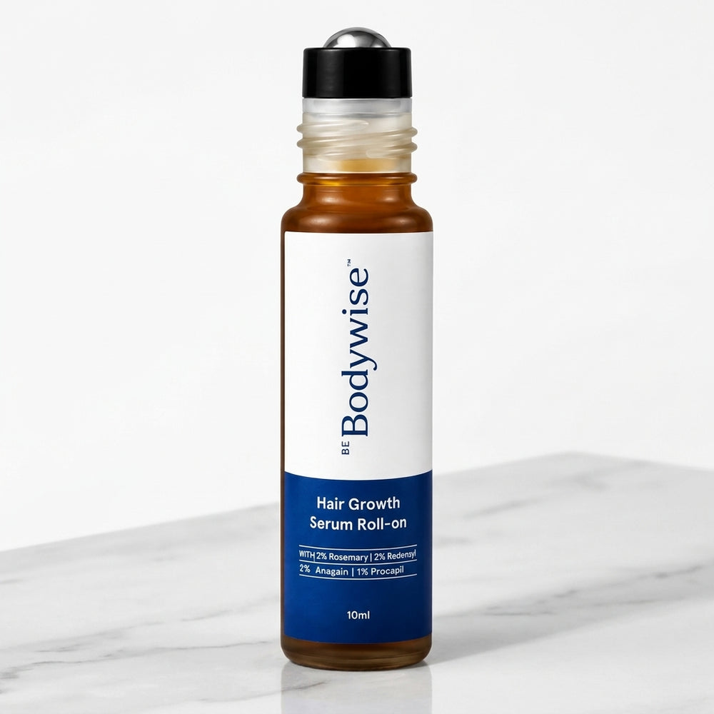 Roll-on Be Bodywise Hair Growth Serum sobre superficie de mármol claro